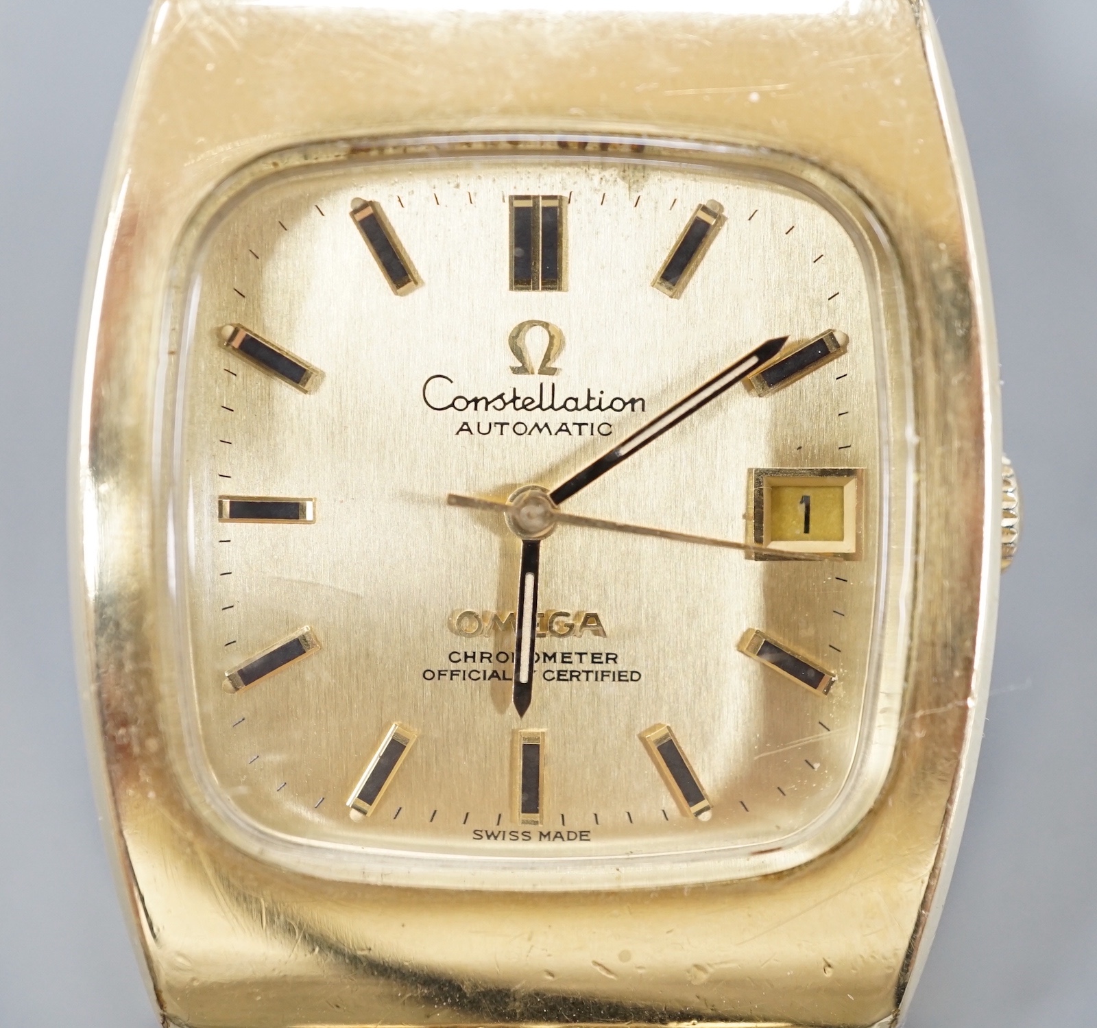 A gentleman's gold plated Omega Constellation Automatic wrist watch, on a gold plated Omega bracelet, case diameter 35mm, with date aperture, no box or papers.